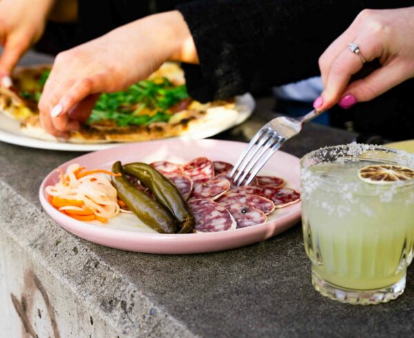 mix of shareplates with two women eating
